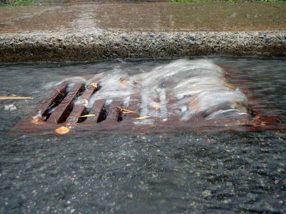 water flowing down a drain pipe
