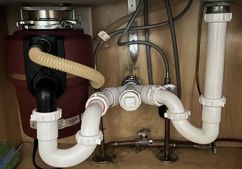 Plumber fixes sink pipes Plumber fixes sink pipes